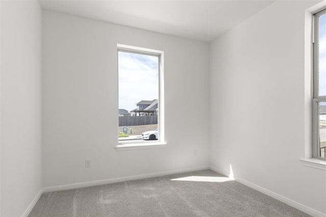 332 Witchhazel Way, San Marcos, TX 78666 - carpeted spare room with plenty of natural light and baseboards