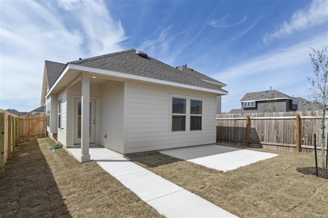 332 Witchhazel Way, San Marcos, TX 78666 - rear view of house with roof with shingles and a patio