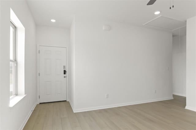 332 Witchhazel Way, San Marcos, TX 78666 - spare room featuring light wood finished floors, a ceiling fan, recessed lighting, and baseboards