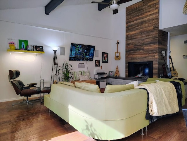 living area featuring high vaulted ceiling, dark wood-type flooring, beamed ceiling, and a fireplace