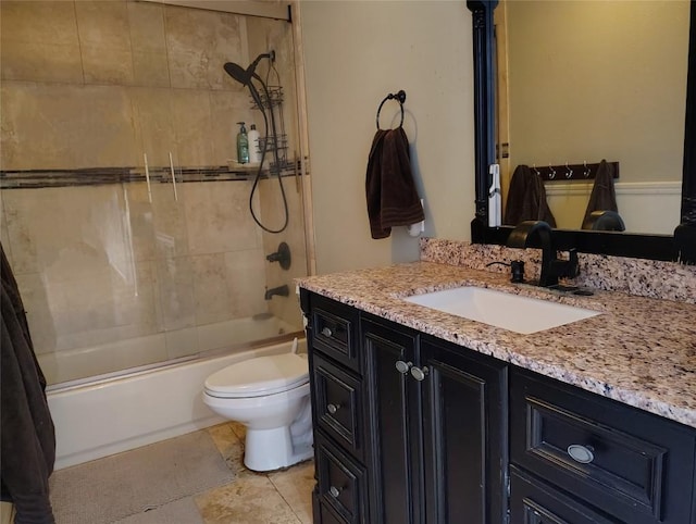 full bathroom featuring combined bath / shower with glass door, vanity, and toilet