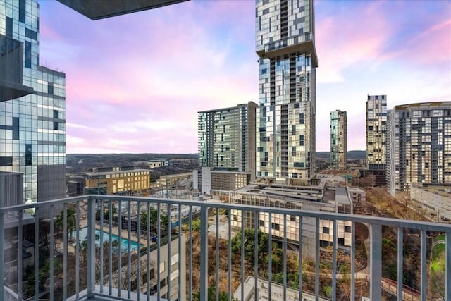 view of balcony at dusk