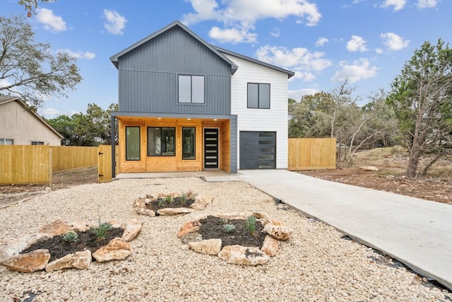 view of front of property with a porch and a garage