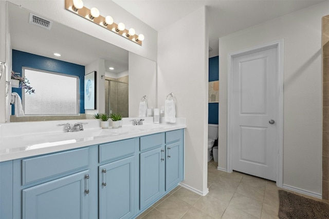 full bathroom with a stall shower, tile patterned flooring, visible vents, and a sink