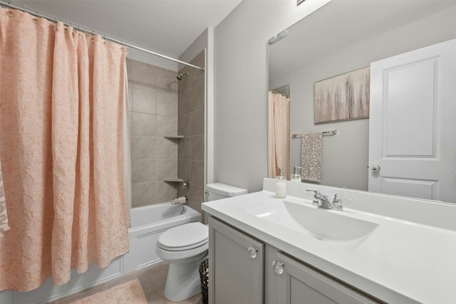 bathroom featuring tile patterned floors, vanity, toilet, and shower / bath combo with shower curtain