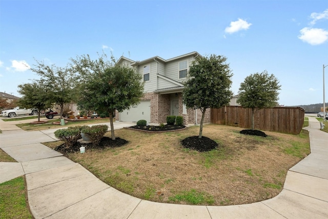 view of front of property with a garage, brick siding, fence, concrete driveway, and a front lawn