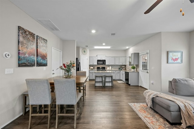 dining room with a ceiling fan, visible vents, dark wood-style flooring, and recessed lighting