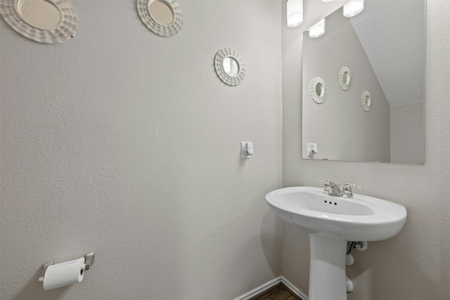 bathroom with lofted ceiling