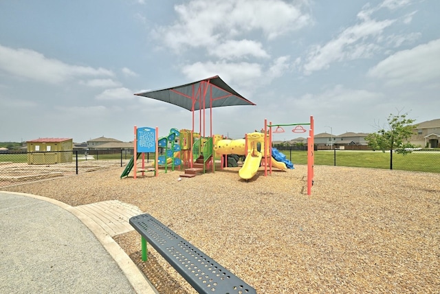 communal playground featuring fence