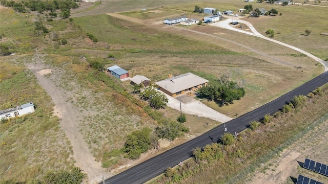 birds eye view of property with a rural view