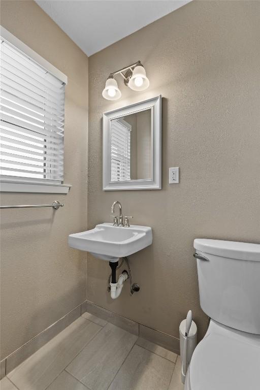 bathroom with sink and toilet