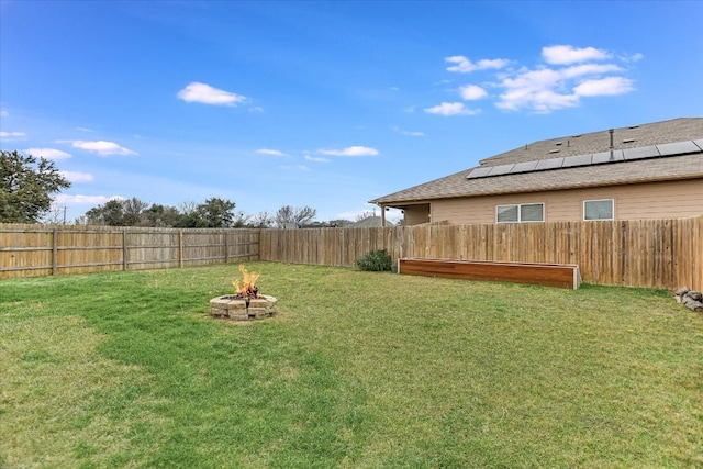 view of yard featuring a fire pit