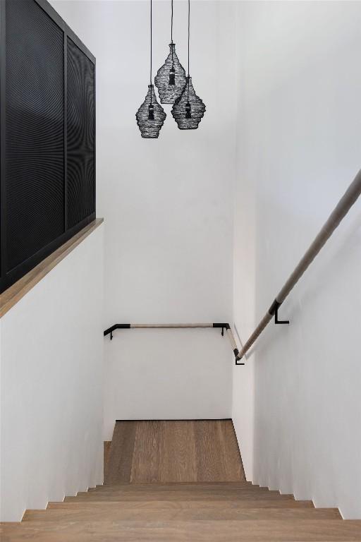 stairway with wood-type flooring