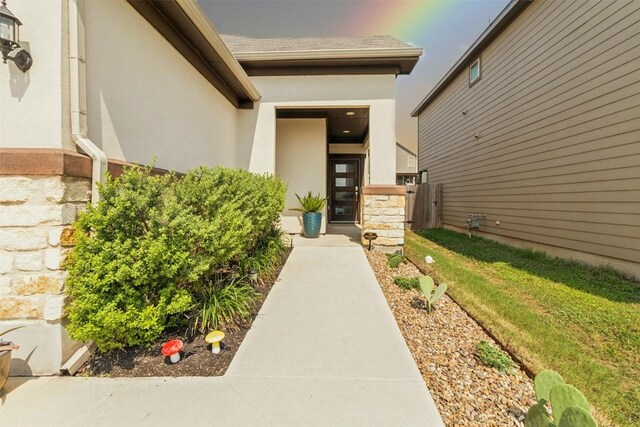 property entrance with a yard