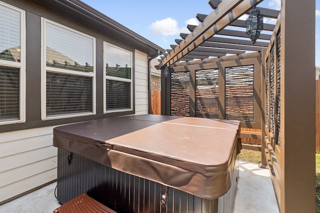 view of patio featuring a hot tub and a pergola