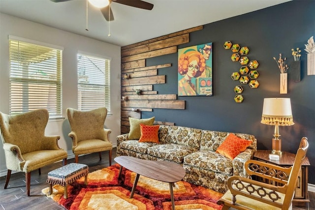 living room with wood-type flooring and ceiling fan