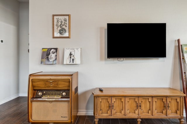 interior space featuring wood finished floors and baseboards