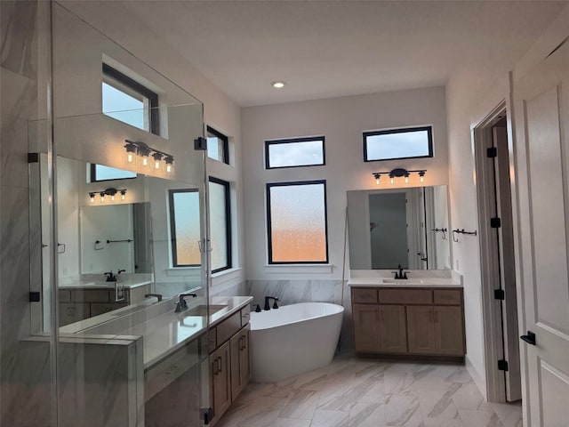 bathroom with vanity, separate shower and tub, and a high ceiling