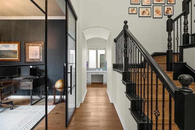 stairs featuring hardwood / wood-style flooring