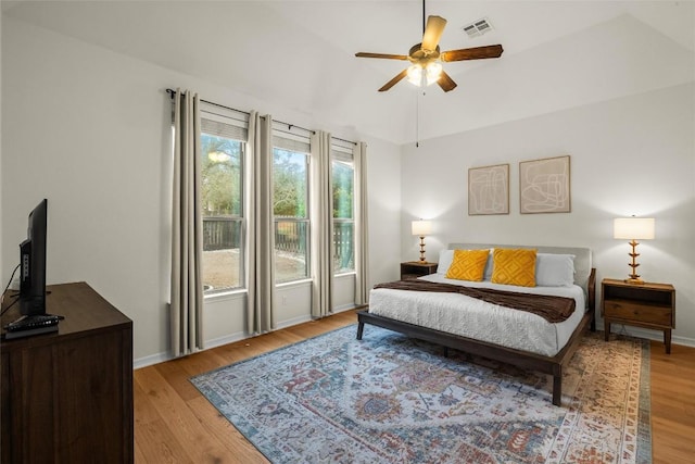 bedroom with ceiling fan and light wood-type flooring