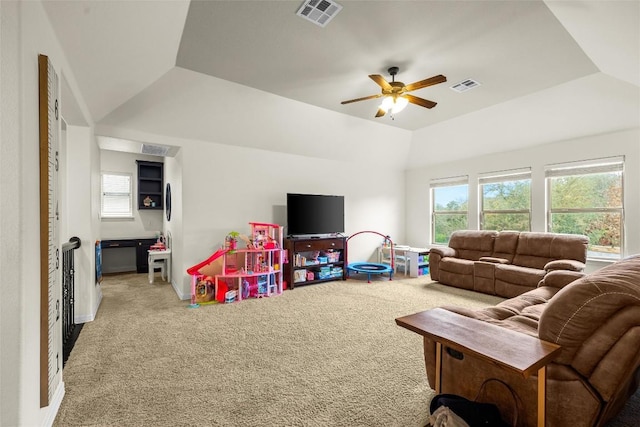 game room with a raised ceiling, carpet floors, and ceiling fan