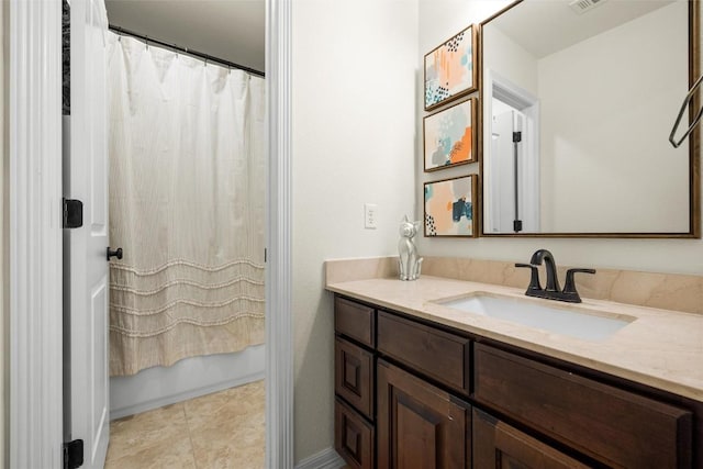 bathroom featuring vanity, tile patterned flooring, and shower / tub combo with curtain