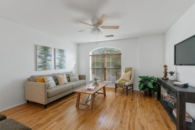 living room with ceiling fan and light wood-type flooring