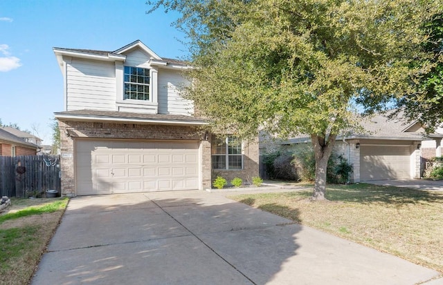 14420 Ballycastle Trl, Austin, TX 78717 - traditional home with concrete driveway, an attached garage, and brick siding