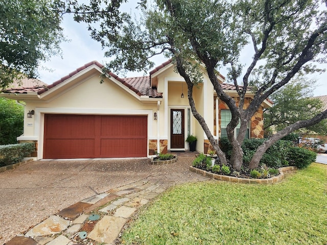 view of front of home featuring a garage and a front lawn