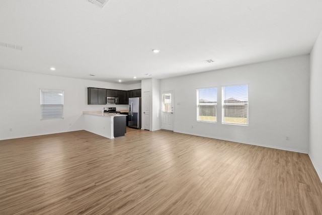 unfurnished living room featuring light hardwood / wood-style flooring