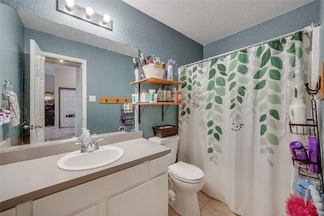 bathroom featuring toilet, a shower with curtain, a textured ceiling, vanity, and tile patterned flooring