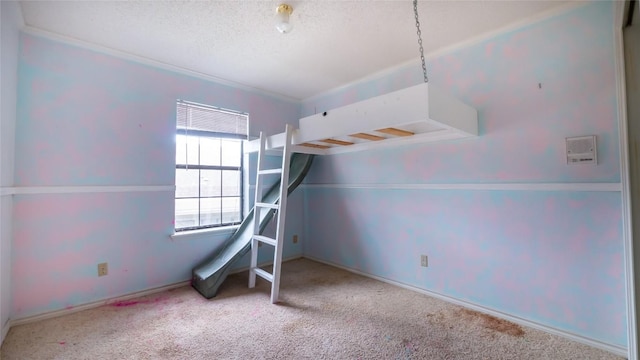 carpeted bedroom with a textured ceiling