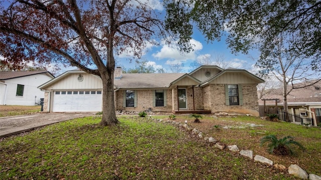 view of front of property with a garage and a front yard