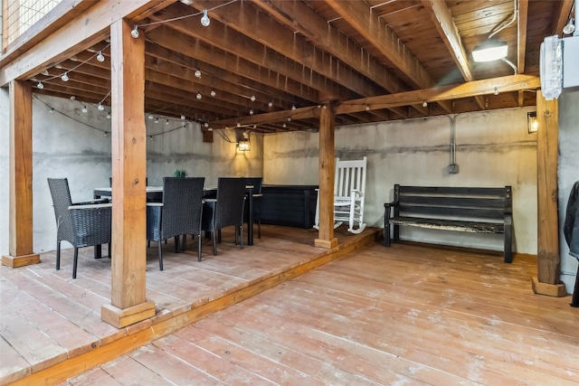 basement with hardwood / wood-style floors