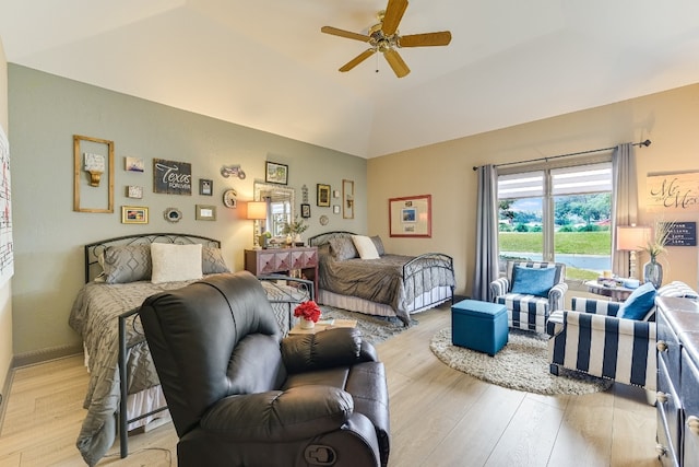 bedroom featuring vaulted ceiling, ceiling fan, access to exterior, and light wood-type flooring