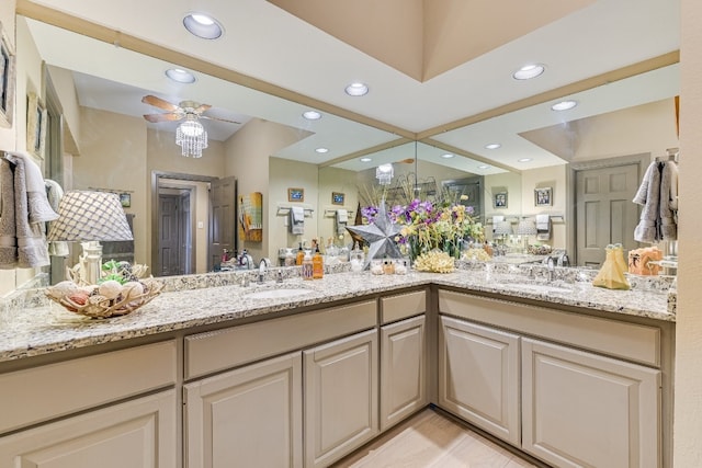 bathroom with ceiling fan and vanity