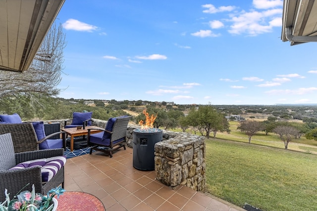 view of patio featuring an outdoor living space with a fire pit