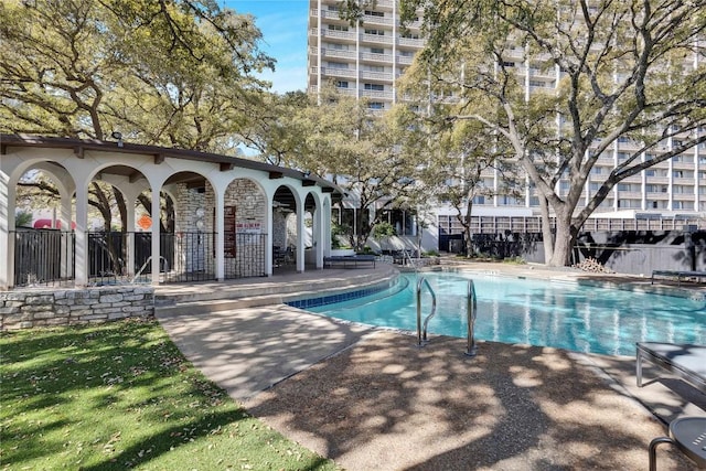 view of swimming pool with a patio