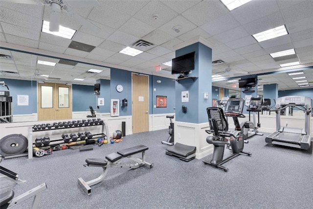 workout area featuring a paneled ceiling