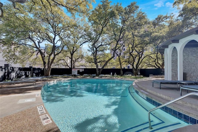 view of swimming pool with a patio area