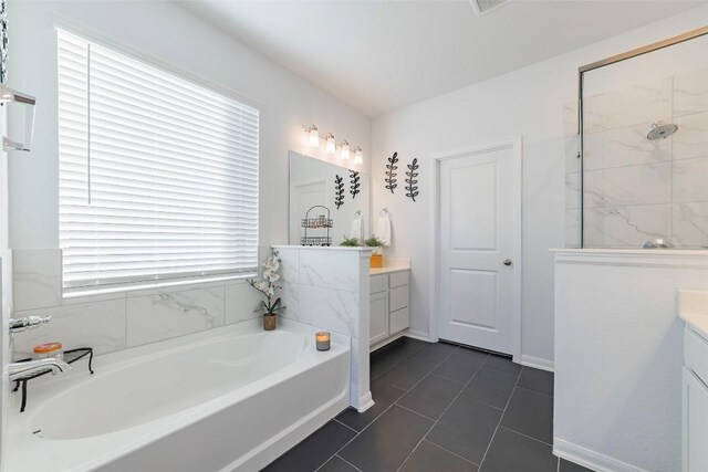 bathroom with vanity, shower with separate bathtub, and tile patterned floors