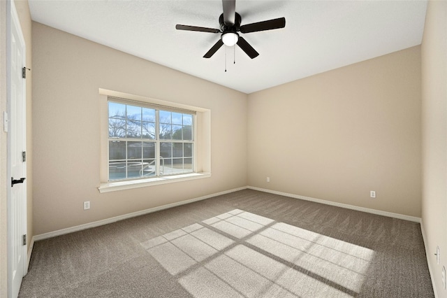 unfurnished room featuring ceiling fan and carpet flooring