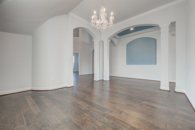 spare room featuring ornate columns, a chandelier, vaulted ceiling, ornamental molding, and dark hardwood / wood-style flooring