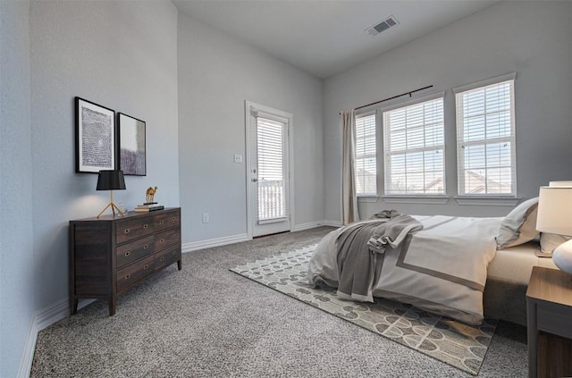 bedroom with carpet and access to outside