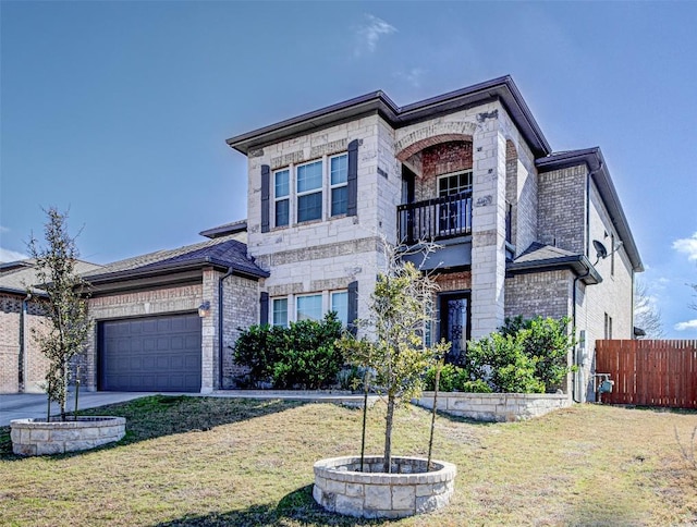 view of front of house with a balcony, a garage, and a front lawn