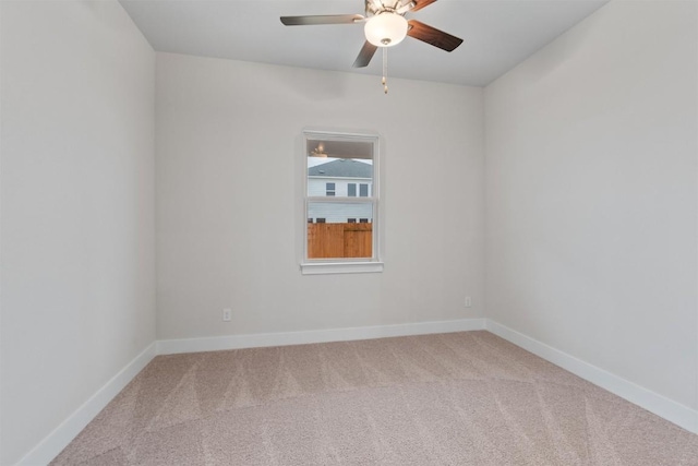 unfurnished room featuring ceiling fan and carpet floors