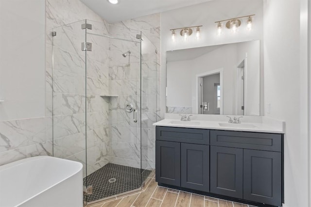 bathroom featuring independent shower and bath, vanity, and tile walls