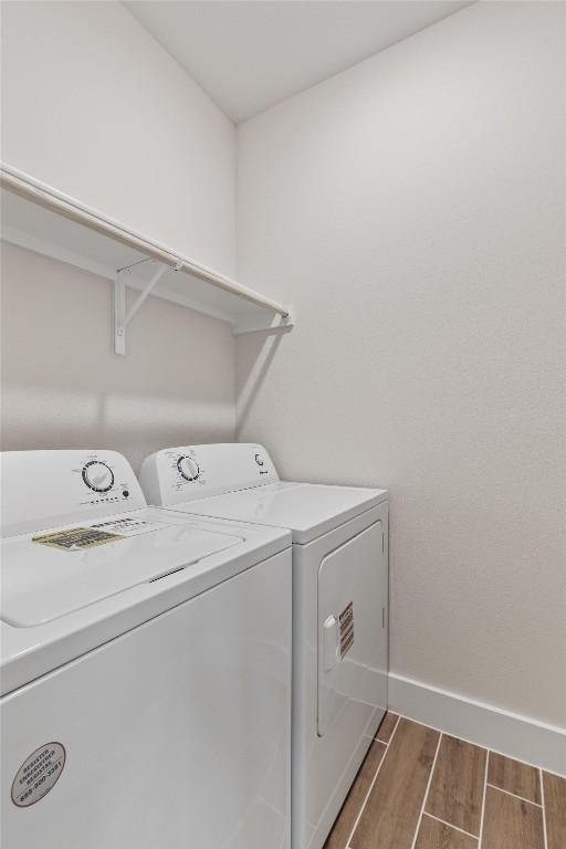 washroom with washing machine and clothes dryer