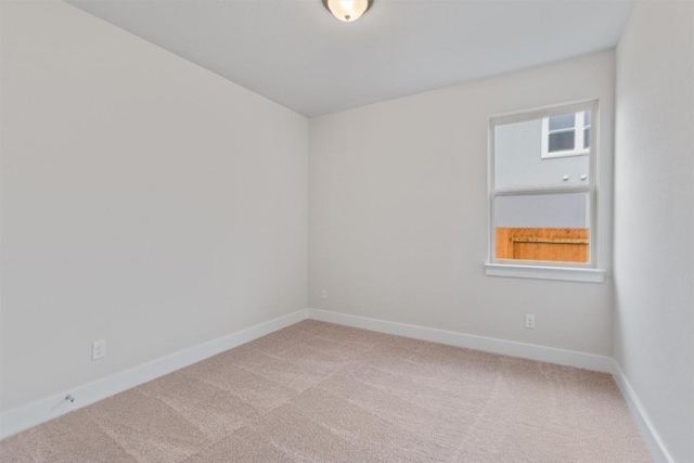 carpeted empty room featuring plenty of natural light