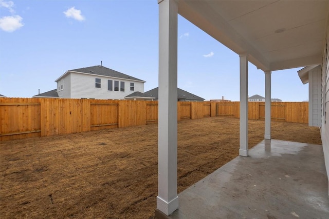 view of yard with a fenced backyard and a patio